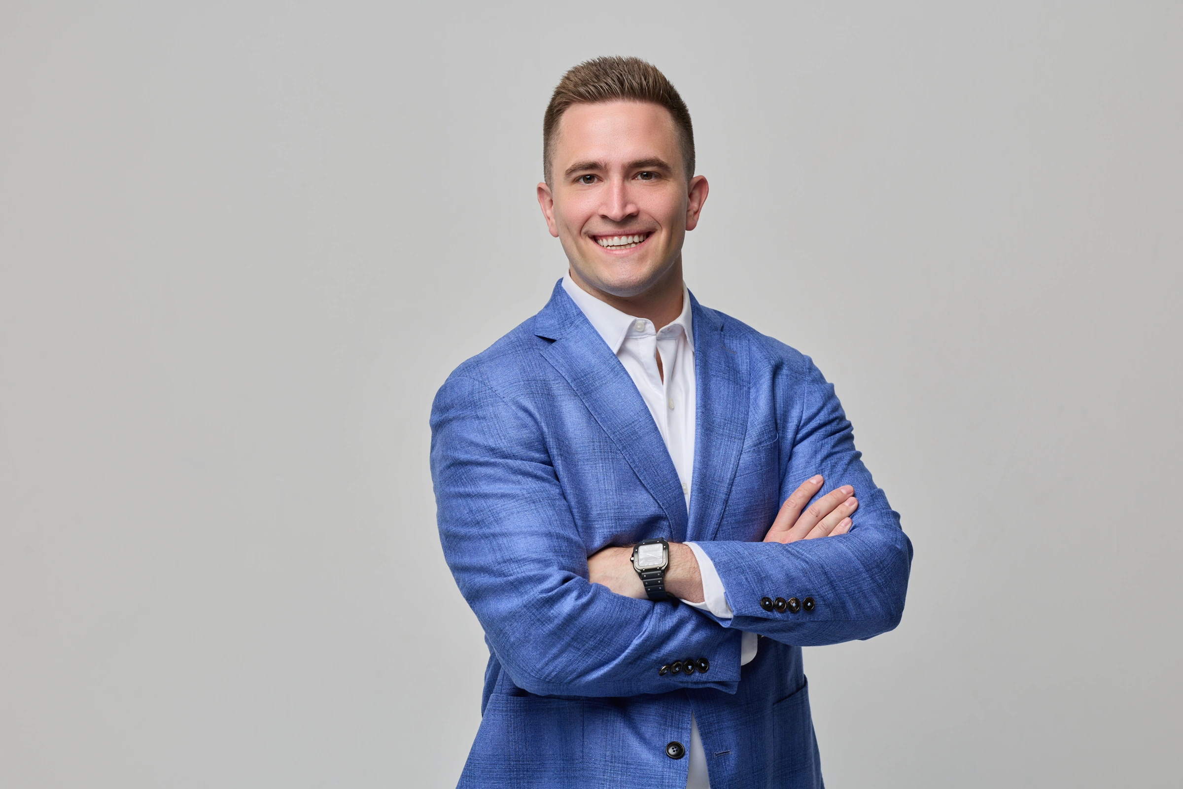 Executive portrait in a blue suit with an open collar